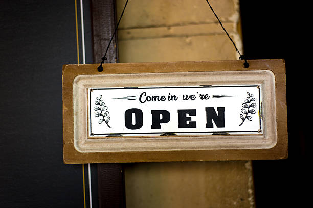 istock Paris, France: White Wood OPEN Sign on Black Background 2212139118