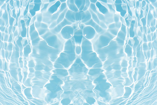 The surface of the clear water in the pond.