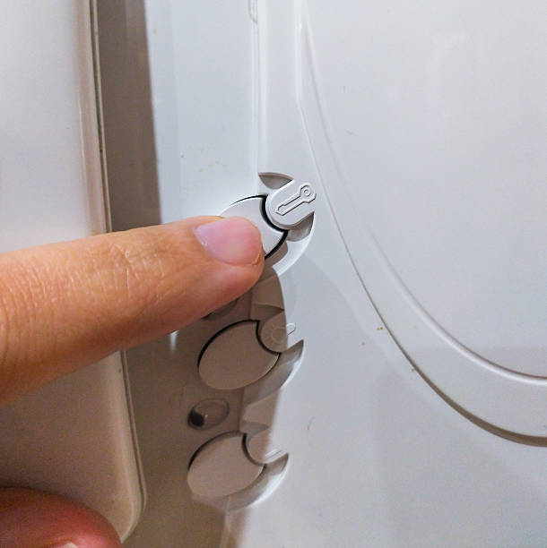 istock Closeup shot focusing on a finger adjusting settings or controls on a white device. Symbol of precision, technology, or domestic appliances. Usable for service or assistance concepts. 2212153816