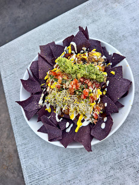 Vegan Purple Nachos and Cheese on a round plate
