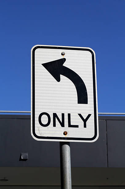 istock Left Turn Only road sign attached to a grey metal pole 2212164178