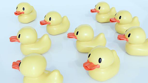 istock group of yellow rubber ducks with orange beaks. 2212168646