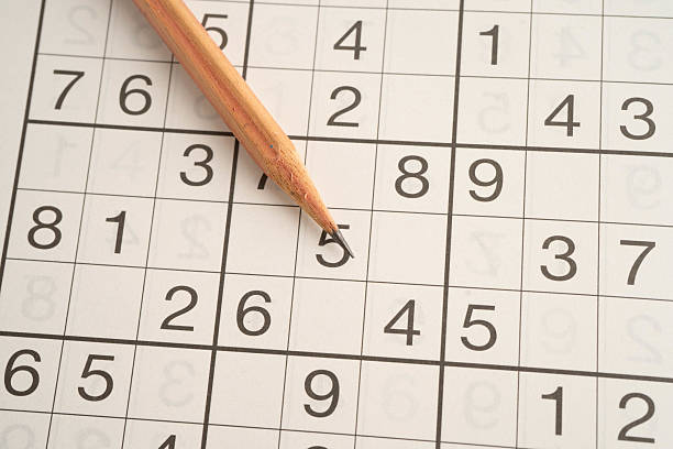 istock Sudoku puzzle, game to play for keep you brain younger for developing Alzheimer disease in senior patient. 2212176359