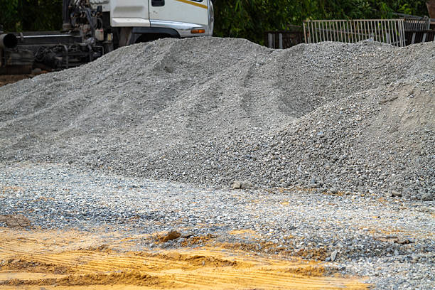 istock Construction action gravel pile development urban site industrial environment ground level view 2212177780