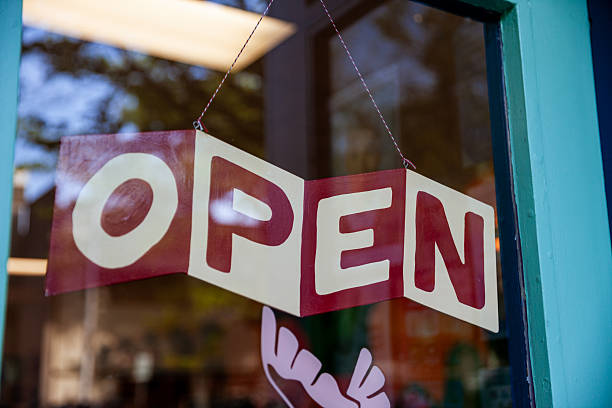 istock Open sign on front door of a Small Business 2212177998