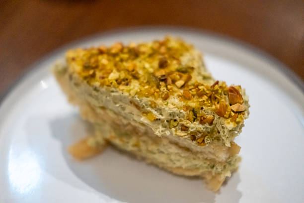 istock Pistachio Tiramisu served on plate in the restaurant 2212178155