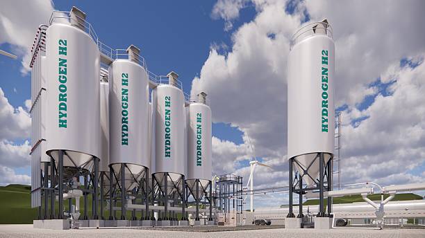 istock 3D rendering Factory Green Hydrogen Tank construction site.Renewable Clean Gas Storage Tanks of Hydrogen .Net zero concept. 2212178329