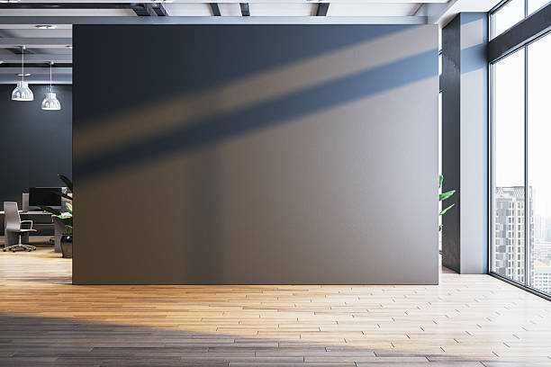 Modern office interior with large blank wall and city view through glass windows, ideal for poster, logo, or signage mockup display concept. 3D Rendering