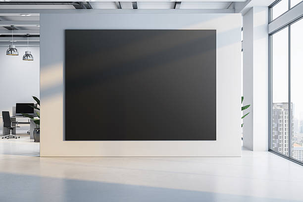 istock Black canvas mockup on white wall in modern office interior with city view through large windows and clean minimal workspace design. 3D Rendering 2212182881