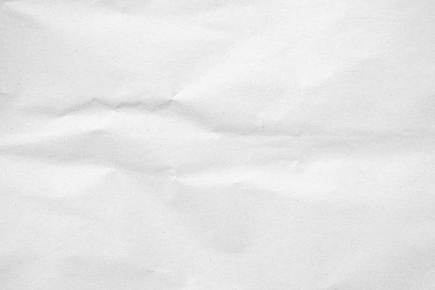 istock White recycled craft paper texture as background. Grey paper texture, Old vintage page or grunge vignette of old newspaper. Pattern rough art creased grunge letter. Hardboard with copy space for text. 2212183320