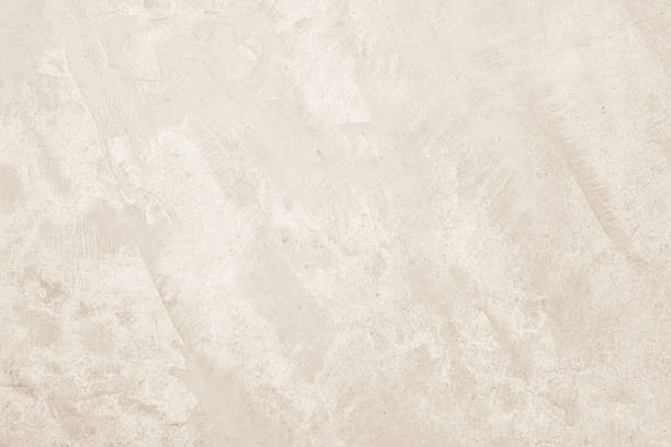 istock Colour old concrete wall texture background. Close up retro plain cream color cement wall background texture. Design paper vintage parchment element. 2212183327