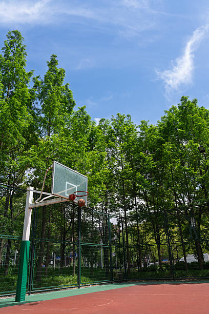 istock Empty basketball court under blue sky and white clouds 2212184320