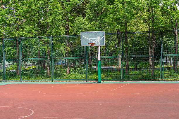 istock Empty basketball court under blue sky and white clouds 2212184930
