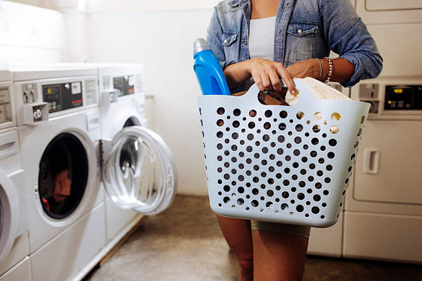 Basket full of dirty laundry on floor
