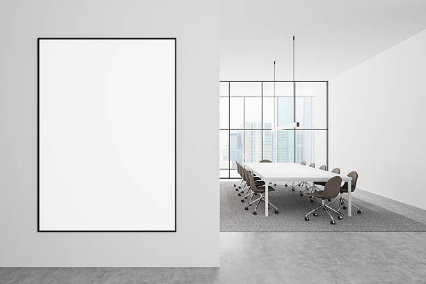 istock Blank poster mockup in modern office interior with conference table and chairs. 3D Rendering 2212187136