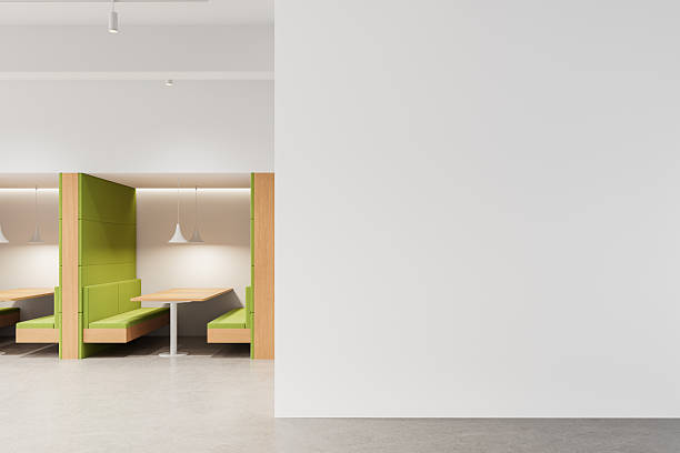 istock Modern interior with green booth seating and blank white wall for poster mockup or design template in clean minimal layout concept. 3D Rendering 2212187249