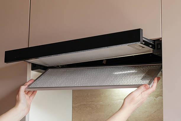 istock Replacing Charcoal filter that eliminates odors in Kitchen in Hood. Constant Ventilation 2212191543