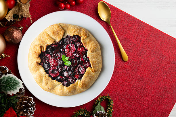 istock Clafoutis tart with red berries, cherries, raspberries and blackberries. Top view table. 2212192555
