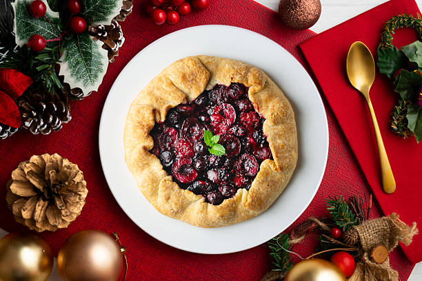 istock Clafoutis tart with red berries, cherries, raspberries and blackberries. Top view table. 2212192556