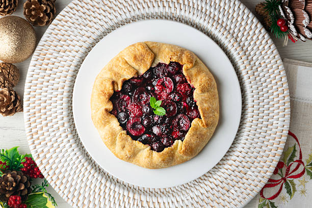 istock Clafoutis tart with red berries, cherries, raspberries and blackberries. Top view table. 2212192558