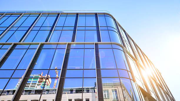 istock Modern office building with glass facade on a clear sky background. 2212193089