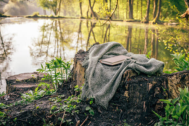 Mindful morning with a book by the pond