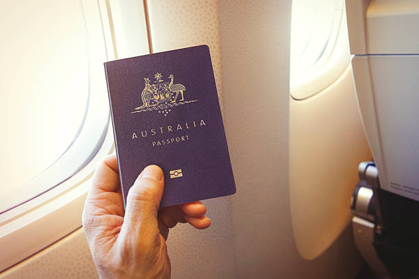 istock Passenger holding Australian passport on the airplane 2212198782