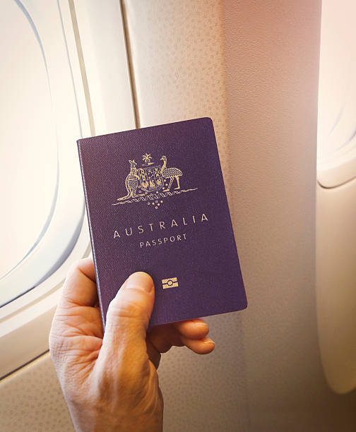 istock Passenger holding Australian passport on the airplane 2212198783