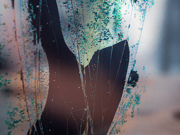 Close-up of broken LCD LED screen showing pixel distortion and texture, creating a digital drama effect.