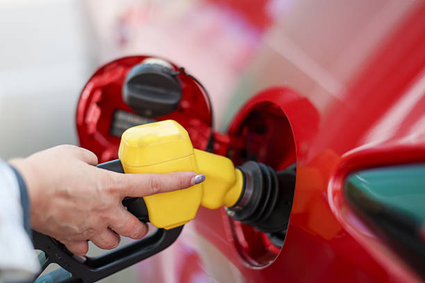 istock Pumping gasoline fuel in car 2212204033