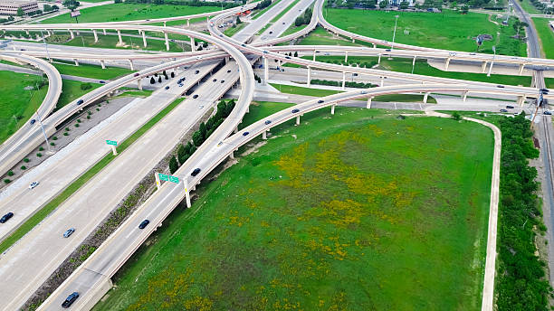 istock Multilevel stack interchanges road junction and traffic movement over Dallas Parkway, Dallas North Tollway, President George Bush Turnpike near Plano Parkway, highway bridge viaduct, vacant land 2212210240