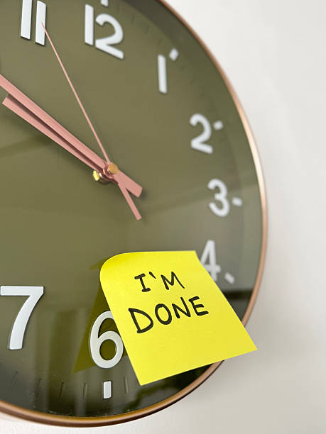 istock Image of handwritten 'i'm done' sticky note on a clock, expressing finality and emotional closure / leaving notes 2212210777