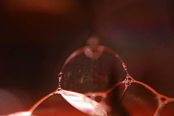 istock Red fluid reflections on black background, liquid surface abstraction, colour edge 2212211726