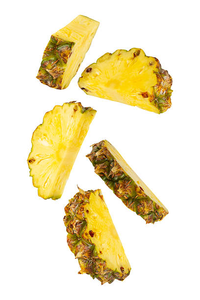 istock Falling Pineapple isolated on white background with clipping path, full depth of field 2212211982