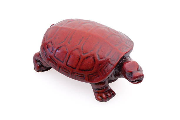 istock small brown wooden turtle on white background 2212212281