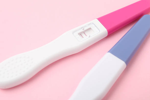 istock Two pregnancy tests on pink background, closeup 2212212649