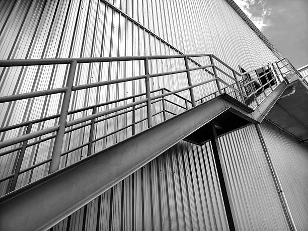 istock A set of stairs ascending a large black wall 2212214081