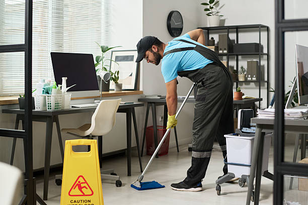 istock Man Cleaning Floor In Office 2212214782