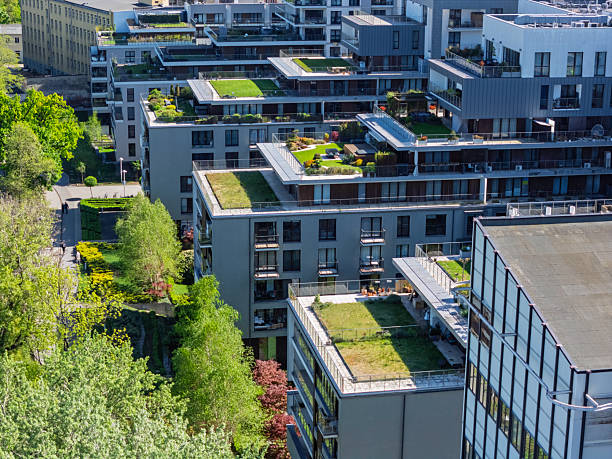 istock Modern urban architecture featuring green rooftops in a vibrant city landscape during daylight hours 2212215579