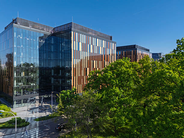 istock Modern office complex featuring glass and wood architecture in a vibrant urban setting during a clear daylight 2212215653
