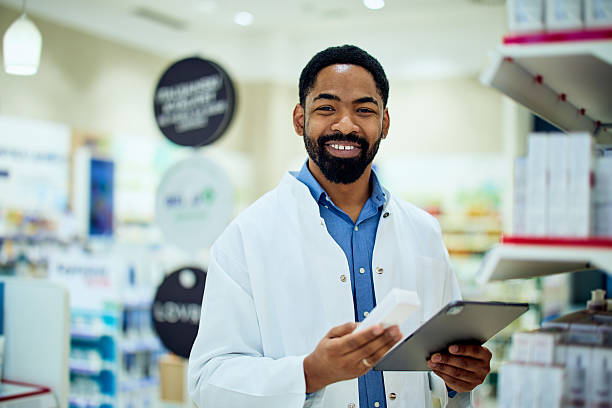 istock Friendly Pharmacist Assisting Customers in a Modern Pharmacy Setting 2212216323