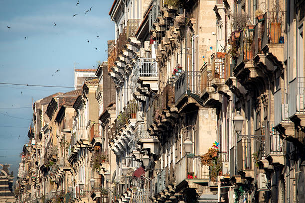 Typical balconies and cornices on Giuseppe Garibaldi Street in Catania, Sicily, Italy, in the morning light