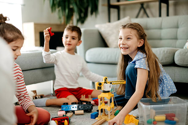 istock Small children enjoying while playing with toys 2212218098
