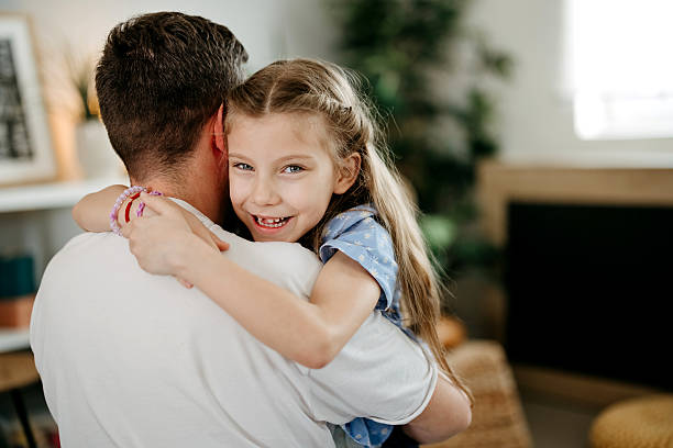 istock Happy loving young father cuddling small daughter 2212218138