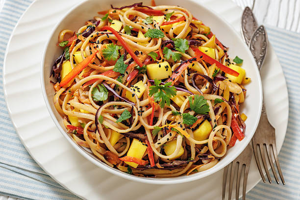 istock Thai Mango Noodle Veggie Salad in a bowl 2212220930