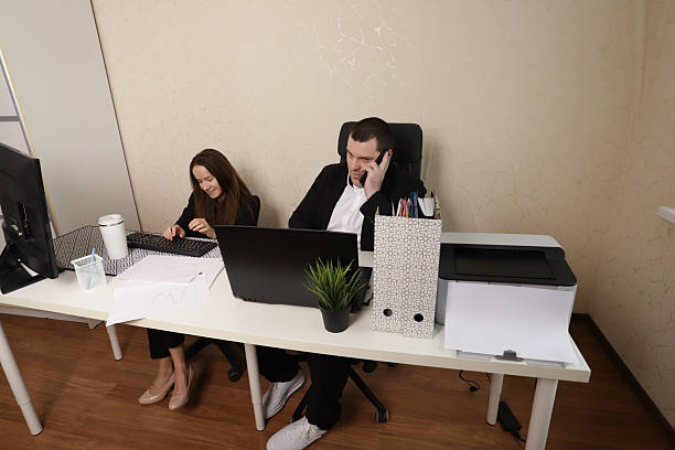 istock Colleagues Having an Office Discussion about Project Papers and Laptop Information 2212221450