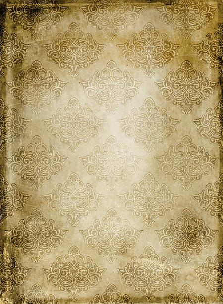 istock Aged grunge paper background with victorian patterns. Natural old paper texture and elegant vintage ornament. 2212221717