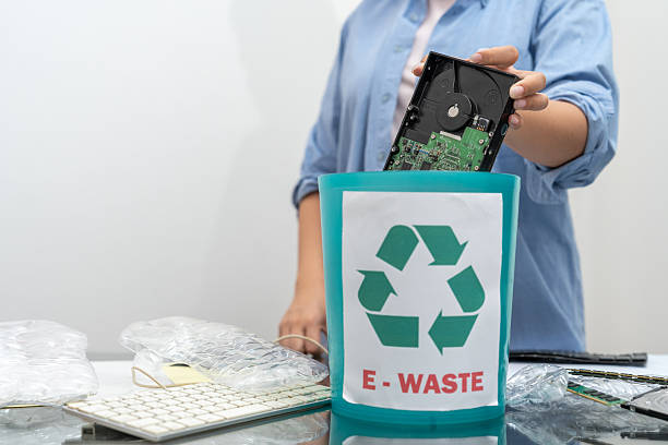 istock Close-up, Asian woman separating general waste, plastic bottles, paper and e-waste or electronic waste for recycling. 2212225601