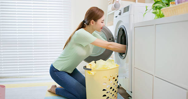 istock asian Housewife Unloads Laundry 2212238984