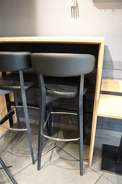 istock Explore stylish bar stools and a modern table setup to enhance your spaces aesthetics 2212238996